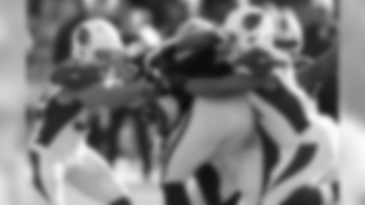 S Tyrann Mathieu (left) and LB Kevin Minter combine for a tackle