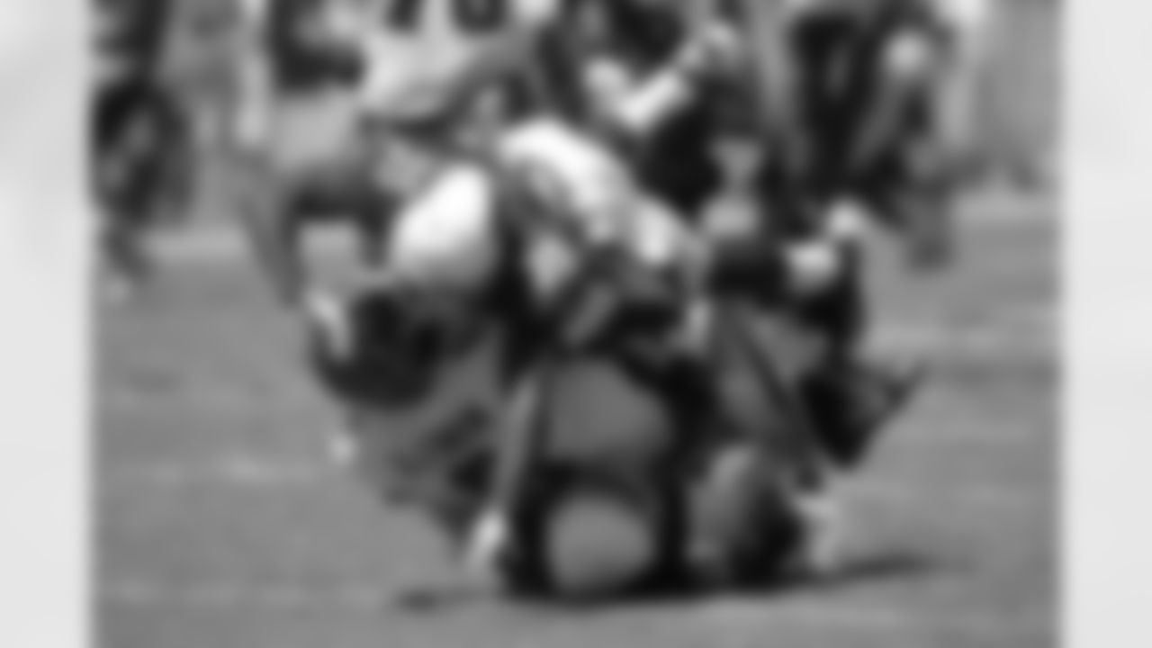 CB Javier Arenas (top) and S Yeremiah Bell crunch Buccaneers QB Mike Glennon