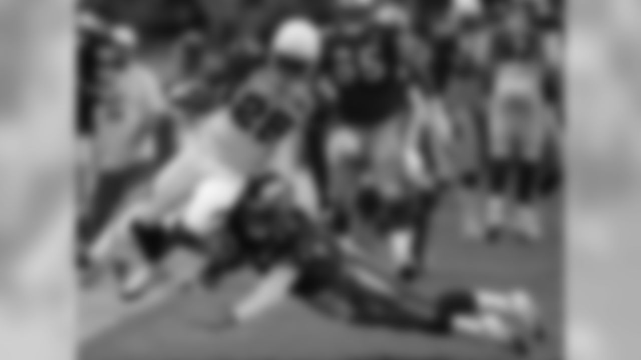 Arizona Cardinals cornerback Eric Green gets tackled by San Francisco 49ers quarterback Tim Rattay during the first half of a regular season NFL game, the first outside of the United States at the Azteca Stadium in Mexico City, Mexico on Sunday Oct. 2, 2005.