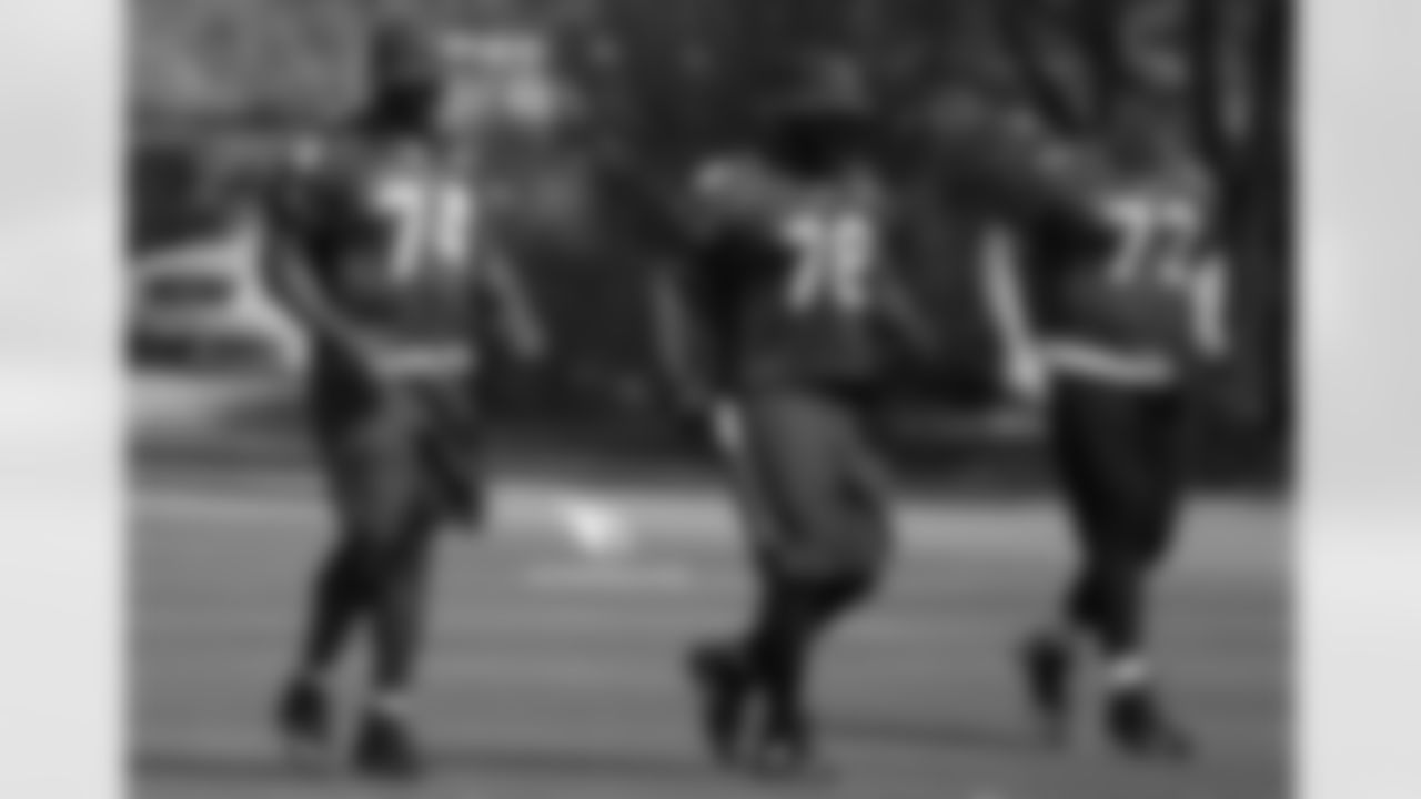T D.J. Humphries (left), T Andre Smith (middle) and T John Wetzel