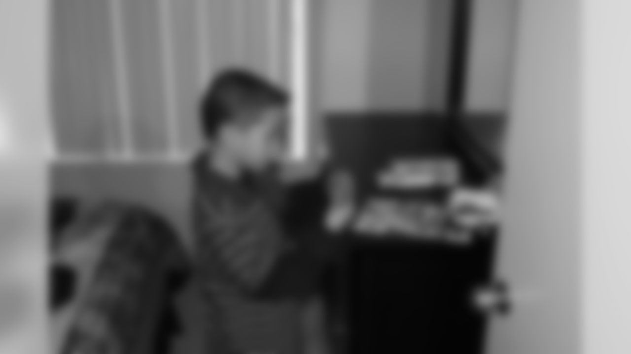 Boy checks out his new room equipped with toys.