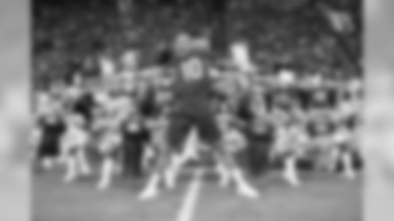 Images of the Cardinals cheerleaders practicing and performing with celebrity fitness motivator Shaun T