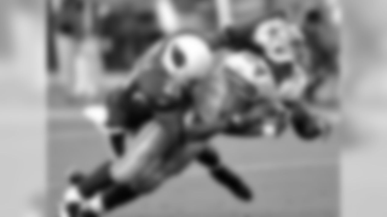 2008: Cowboys RB Marion Barber scores a touchdown with Cardinals S Antrel Rolle in pursuit
