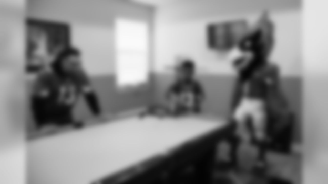 Images of Cardinals receiver Christian Kirk delivering surprise Super Bowl tickets to Devin Manigo at his home in Texas