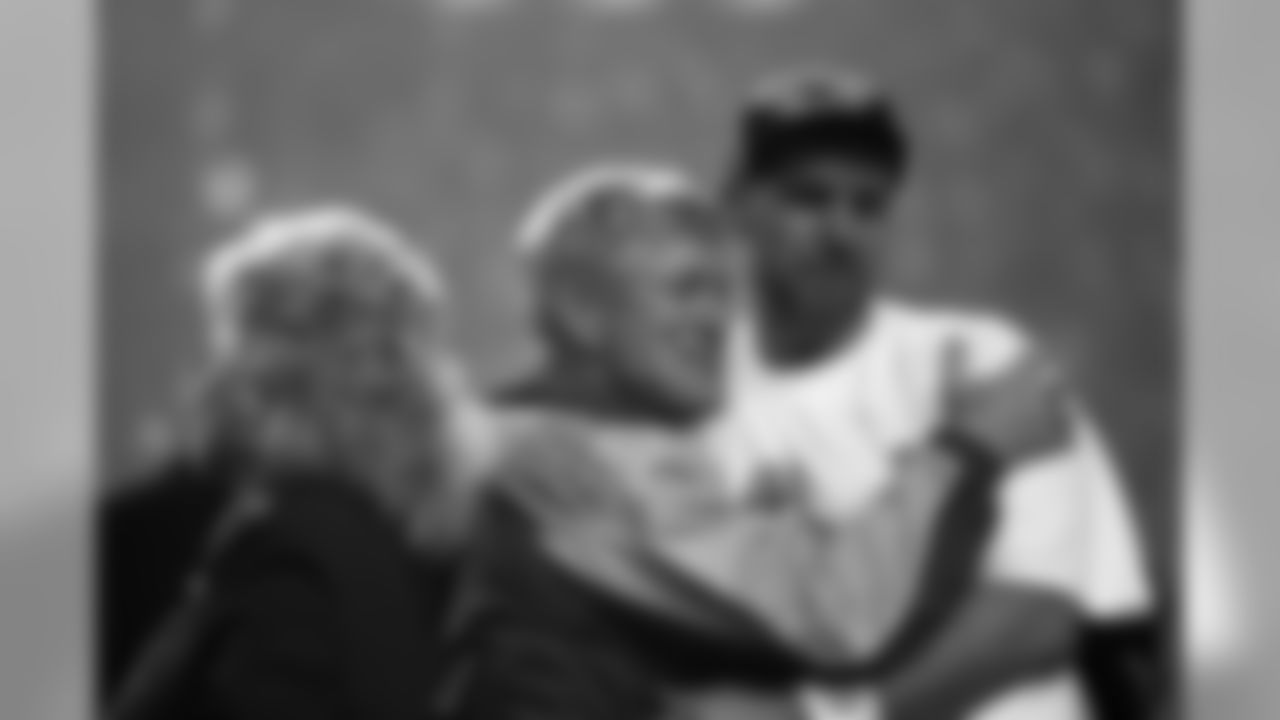 Warner celebrates his 2000 Super Bowl win with Rams coach Dick Vermeil