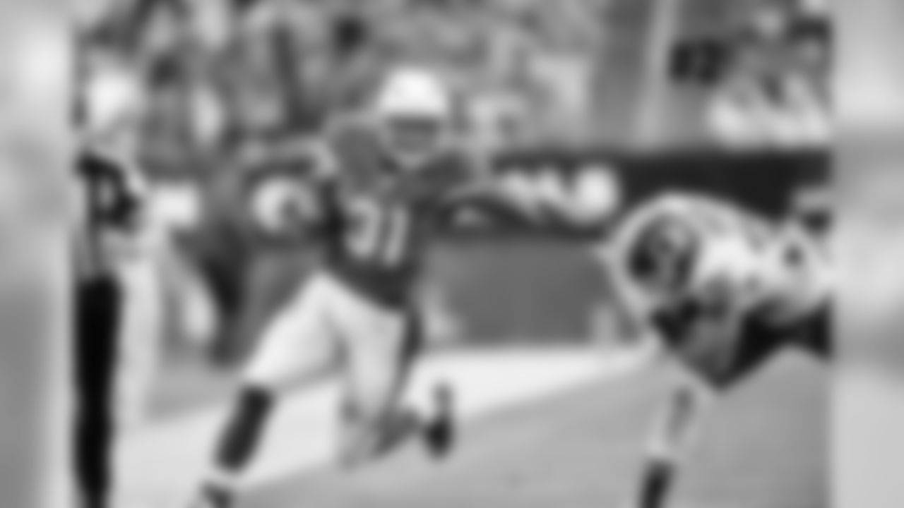 RB David Johnson stiff arms a defender. Johnson totaled 175 yards from scrimmage against the Redskins, his 12th game with 100+ yards.