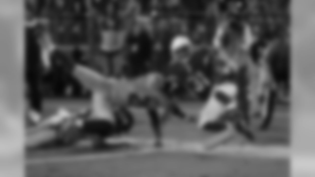 Johnson is knocked out-of-bounds against Seattle