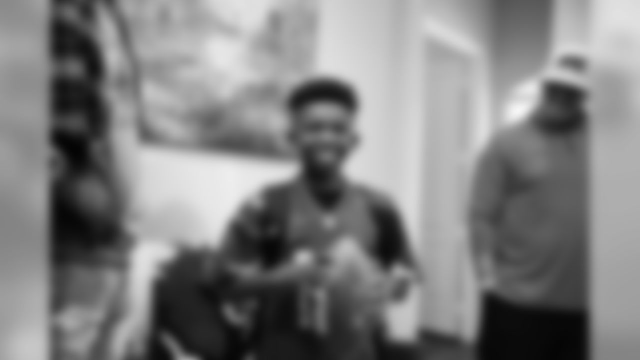 Images of Cardinals receiver Christian Kirk delivering surprise Super Bowl tickets to Devin Manigo at his home in Texas