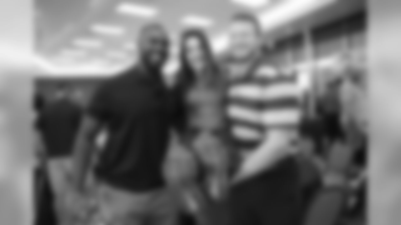 From left: LB Chandler Jones, former coaching intern Jen Welter and DT Josh Mauro