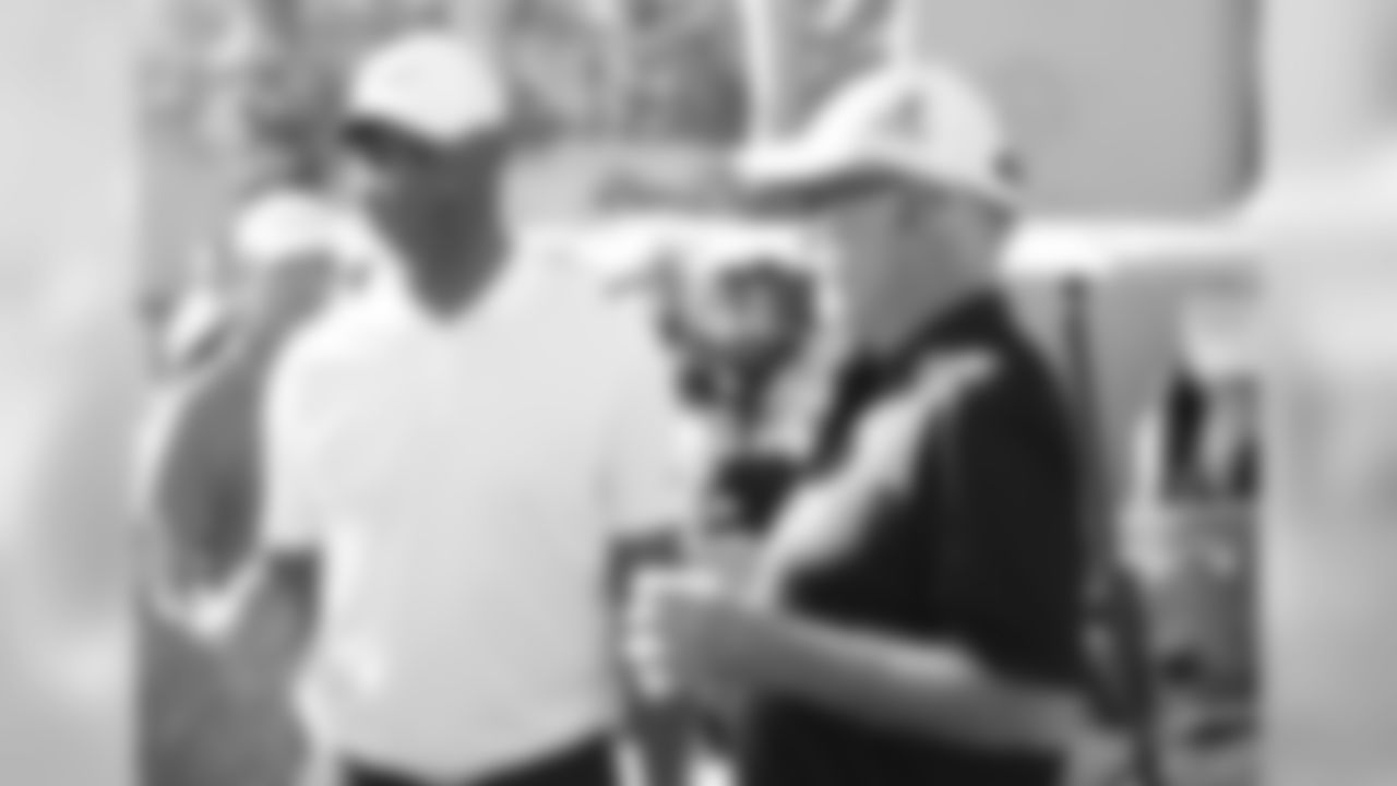 Former NFL RB Marcus Allen (left) before the golf began