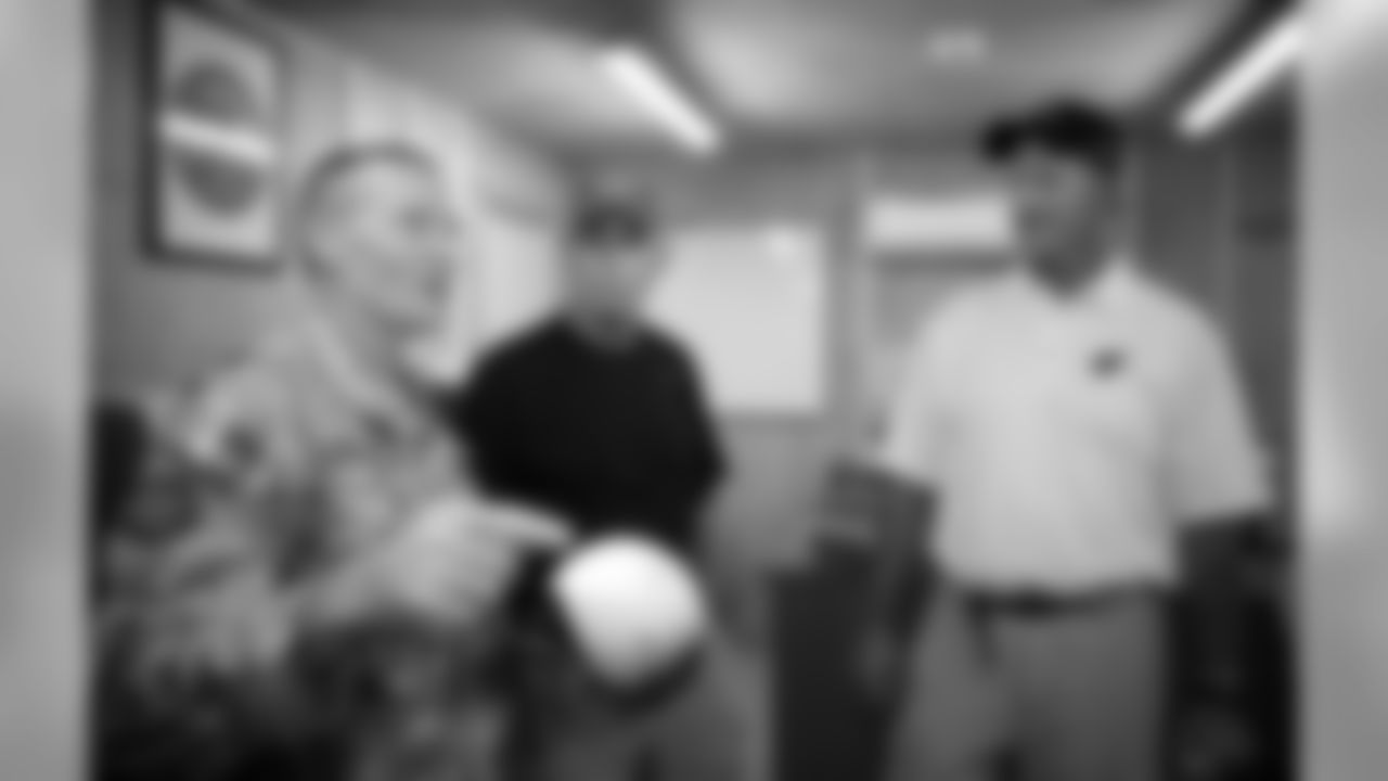 Whisenhunt (right) and Jim E. Mora talk to LTC Sam Houston in Iraq