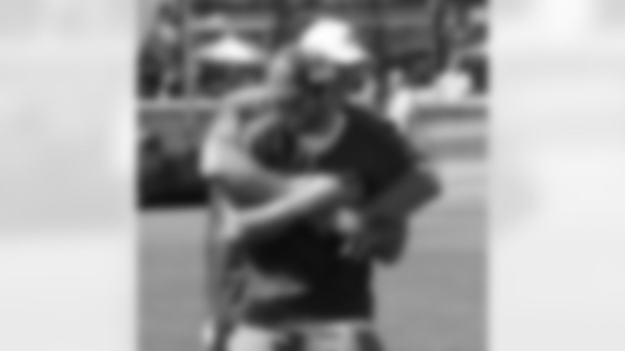 Brian Urlacher good-naturedly attacks Christian Ponder after a game