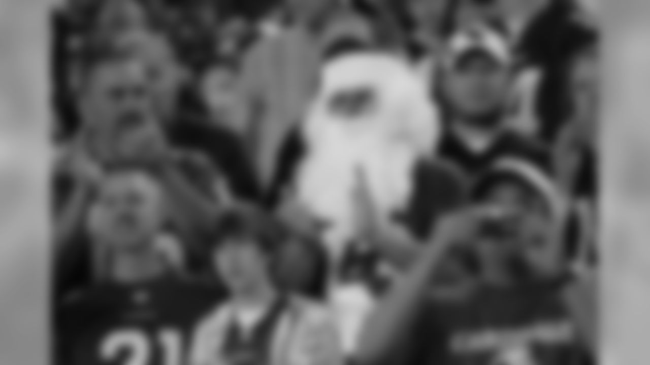 Santa Claus rooting for the hometown Cardinals