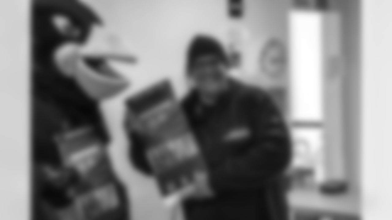 Arizona Cardinals linebacker Dennis Gardeck (45) presents Orin Wakefield with Super Bowl tickets on Tuesday, Jan. 24, 2023 in Phoenix, AZ.