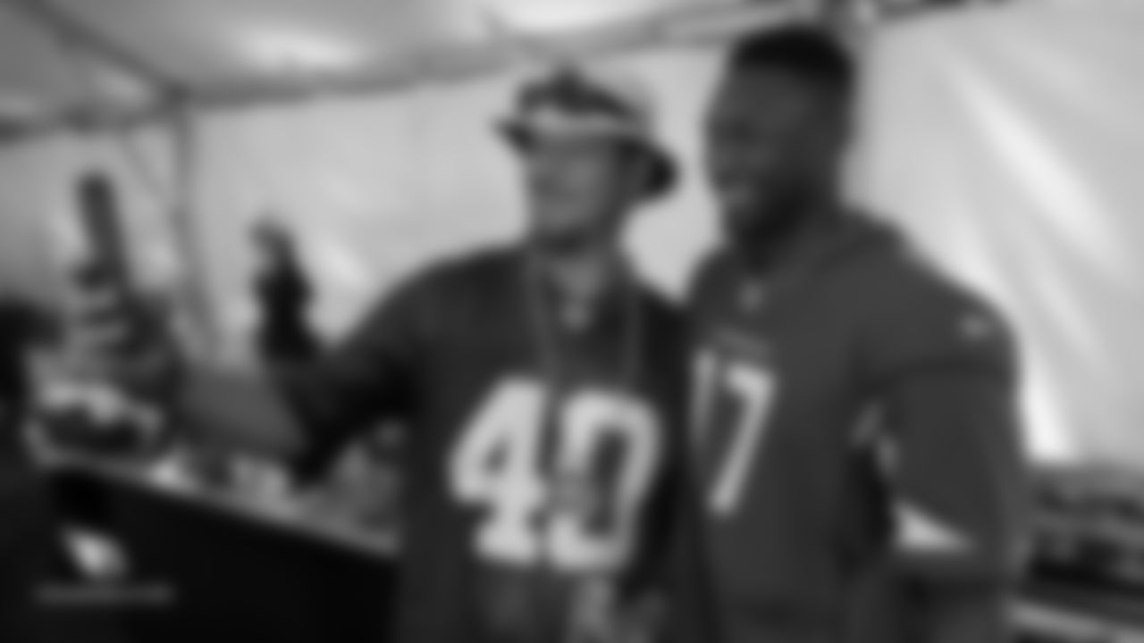 WR Jalen Tolliver takes a photo with a fan during the Cardinals' draft party outside State Farm Stadium last Thursday
