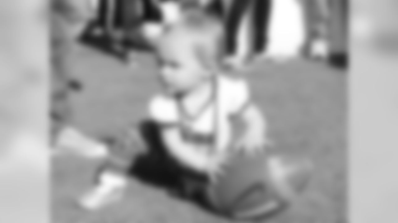 Young Cardinals fan playing with a football