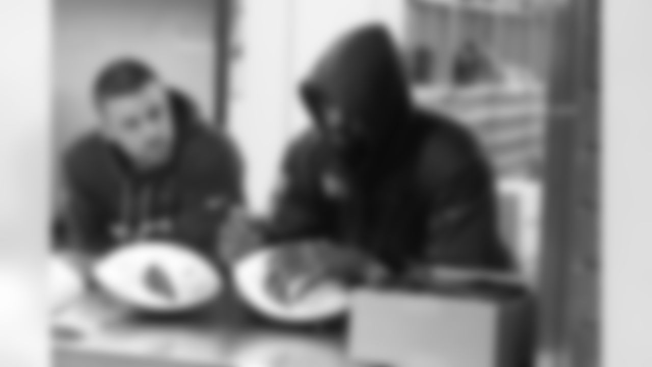 LB Chandler Jones signs a football