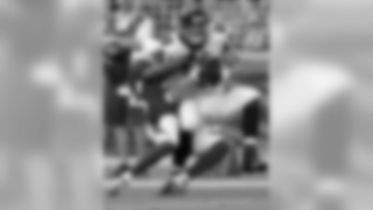 Jerraud Powers brings down Falcons tight end Tony Gonzalez.
