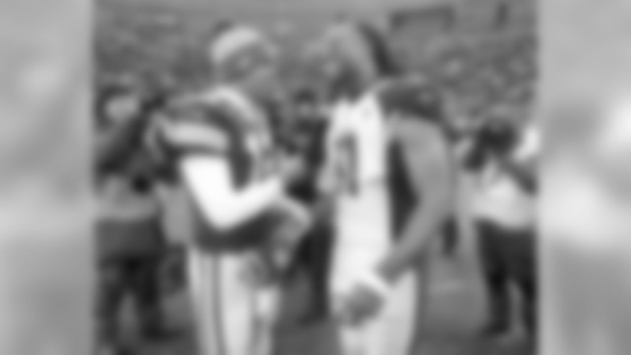 Green Bay Packers quarterback Aaron Rodgers and Arizona Cardinals wide receiver Larry Fitzgerald talk out on the field following the conclusion of an NFL football game Sunday, Dec. 2, 2018, in Green Bay, Wis. Arizona won 20-17.