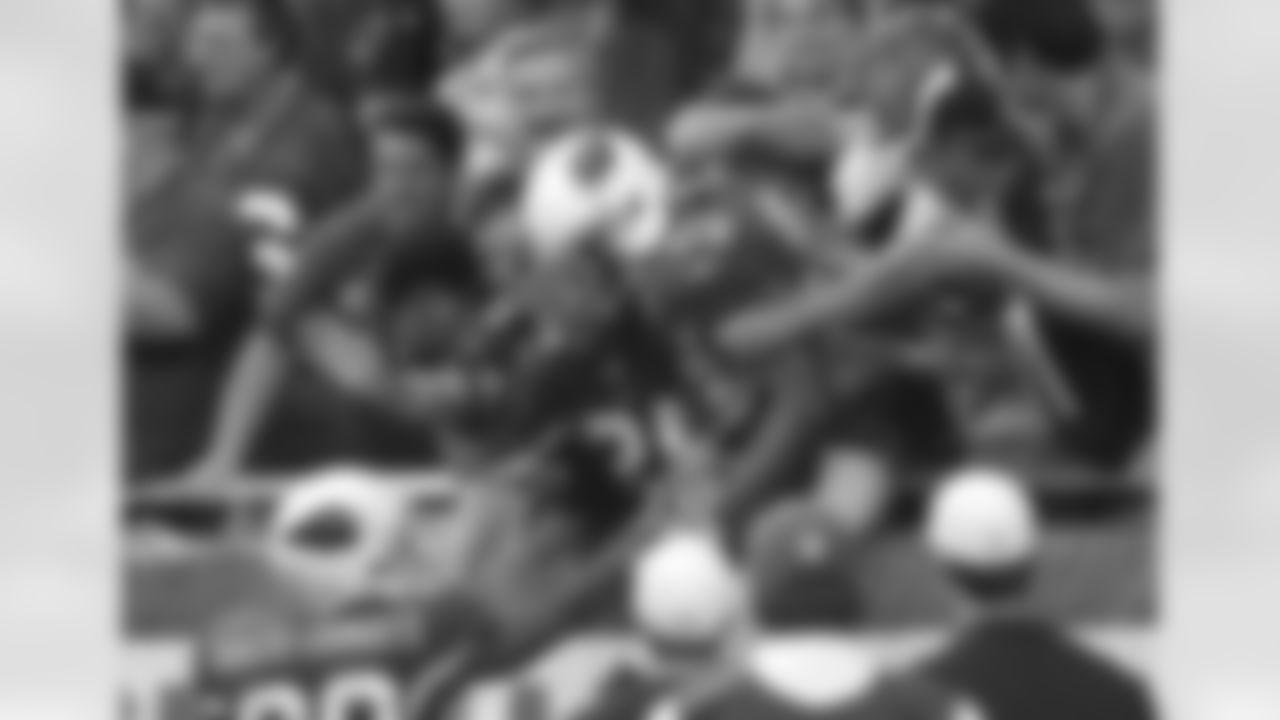 Kerry Rhodes celebrates with fans in 2010