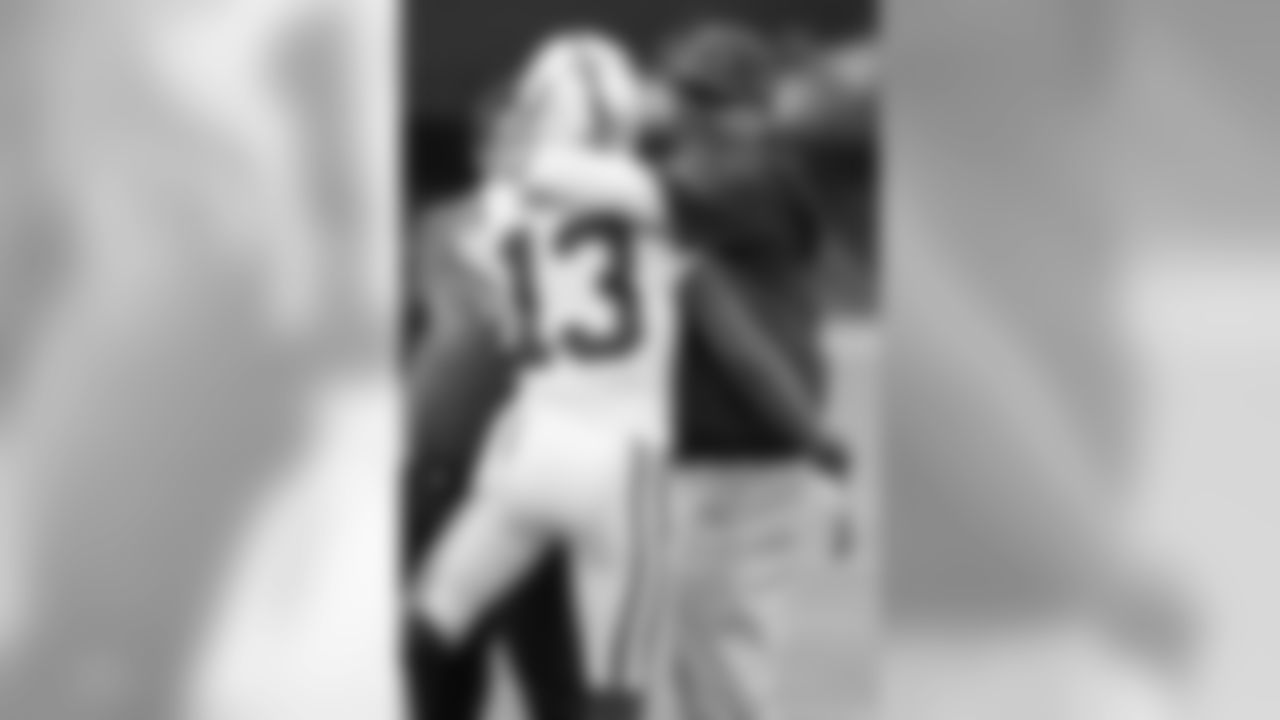 Bruce Arians hugs his former player, Colts WR T.Y. Hilton.
