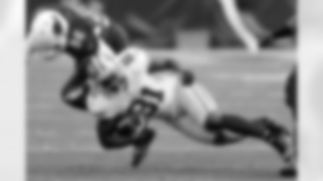 Anquan Boldin is brought down by Karlos Dansby.