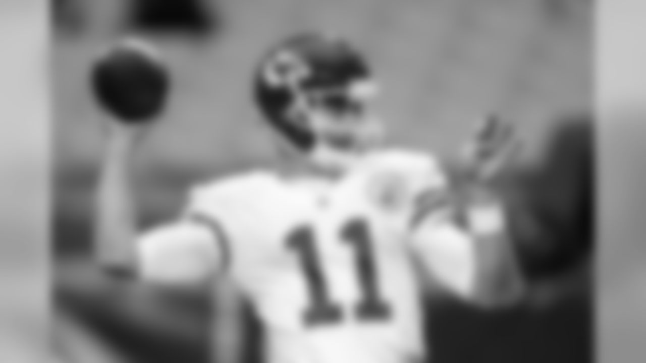 Chiefs QB Alex Smith warms up before the game