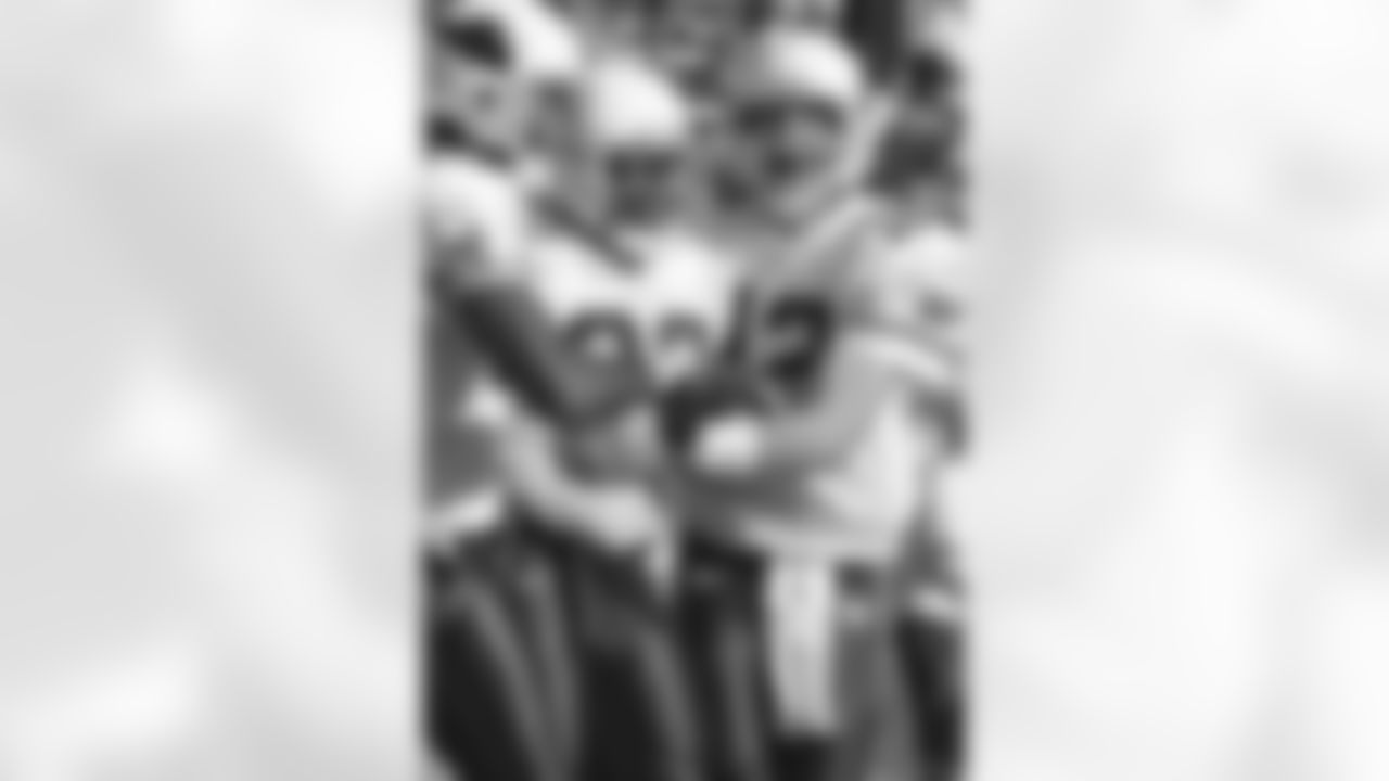 Emmitt Smith celebrates with Josh McCown in 2004