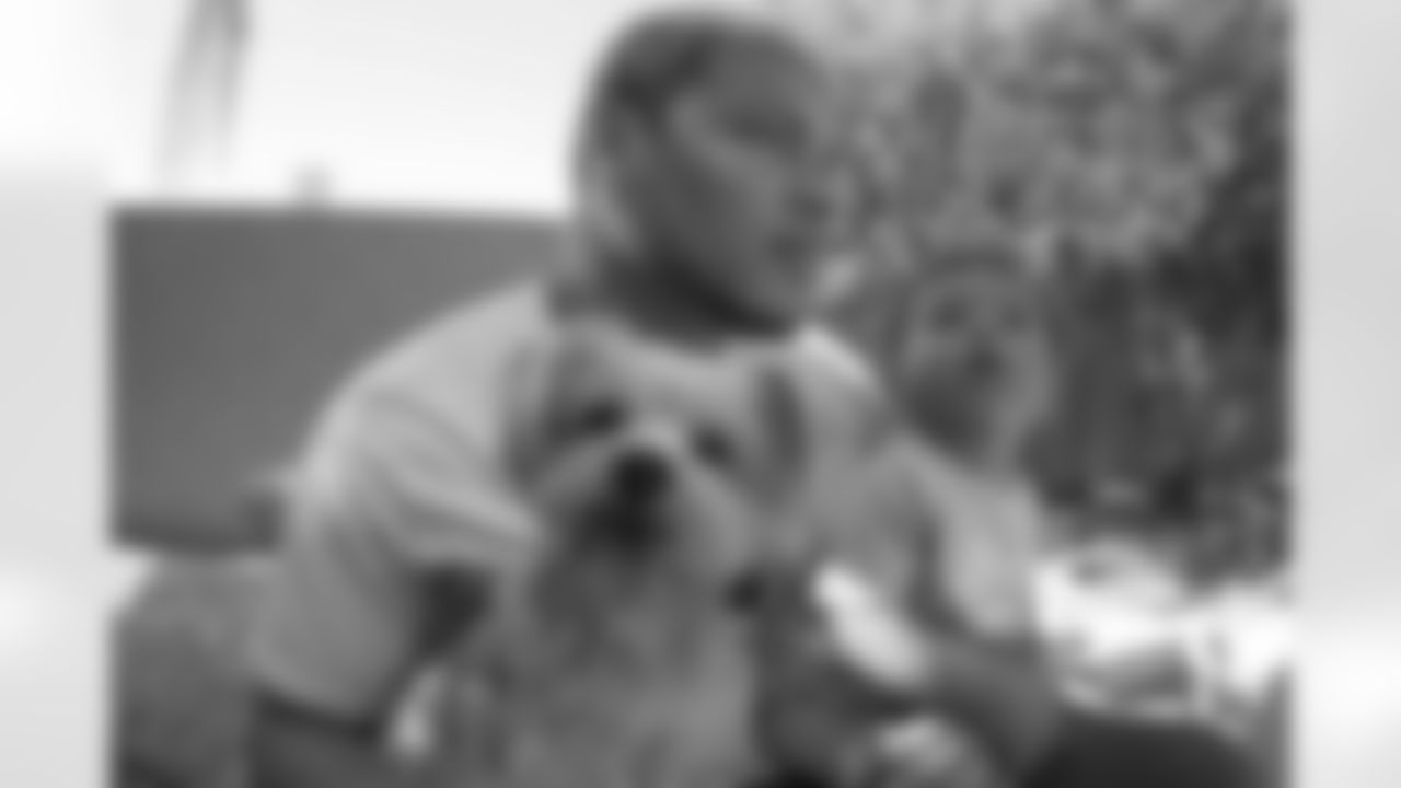S Tyrann Mathieu with his son, Tyrann Jr. and dog, King