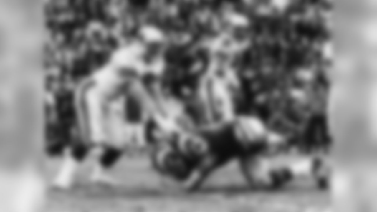 1975: G Conrad Dobler blocks Rams DT Merlin Olsen