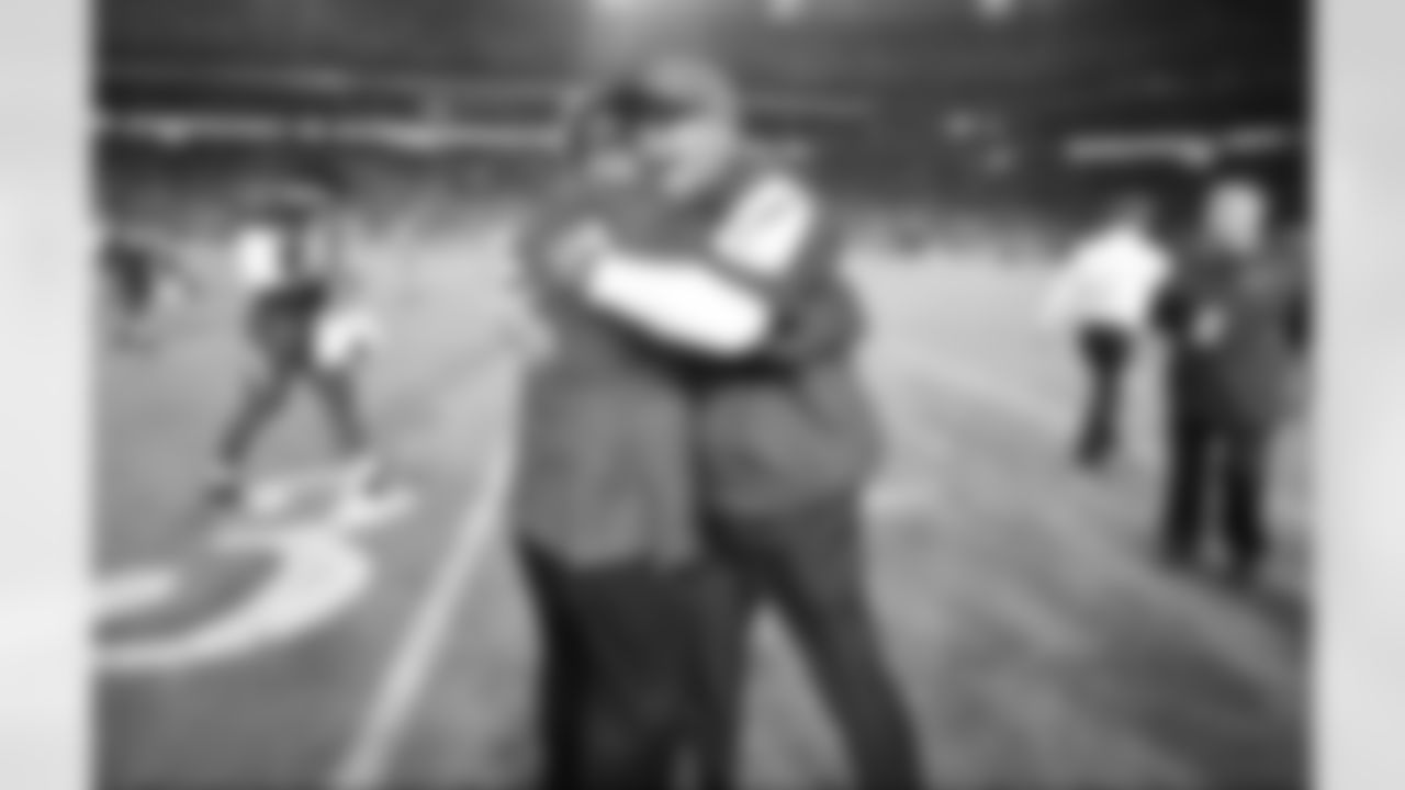 Coach Bruce Arians hugs president Michael Bidwill