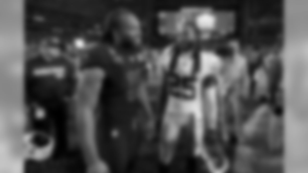 Cardinals wide receiver Larry Fitzgerald greets 49ers cornerback Richard Sherman after the game on Thursday Night Football. The 49ers won 28-25.