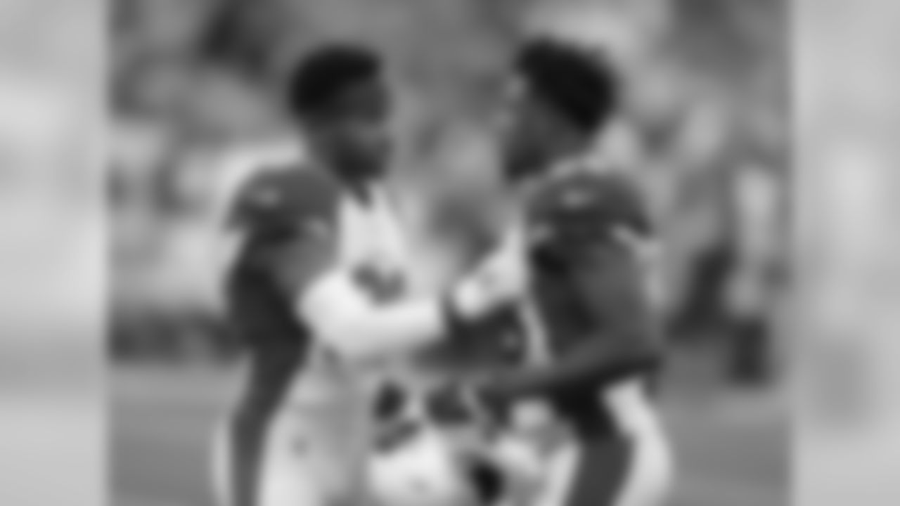 Cornerbacks Justin Bethel (left) and Brandon Williams (right) huddle up