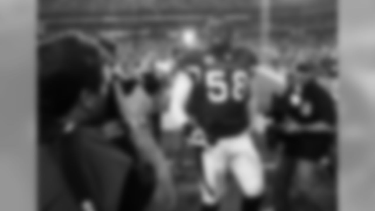 2010: LB Karlos Dansby walking off the field after beating the Packers in the playoffs.
