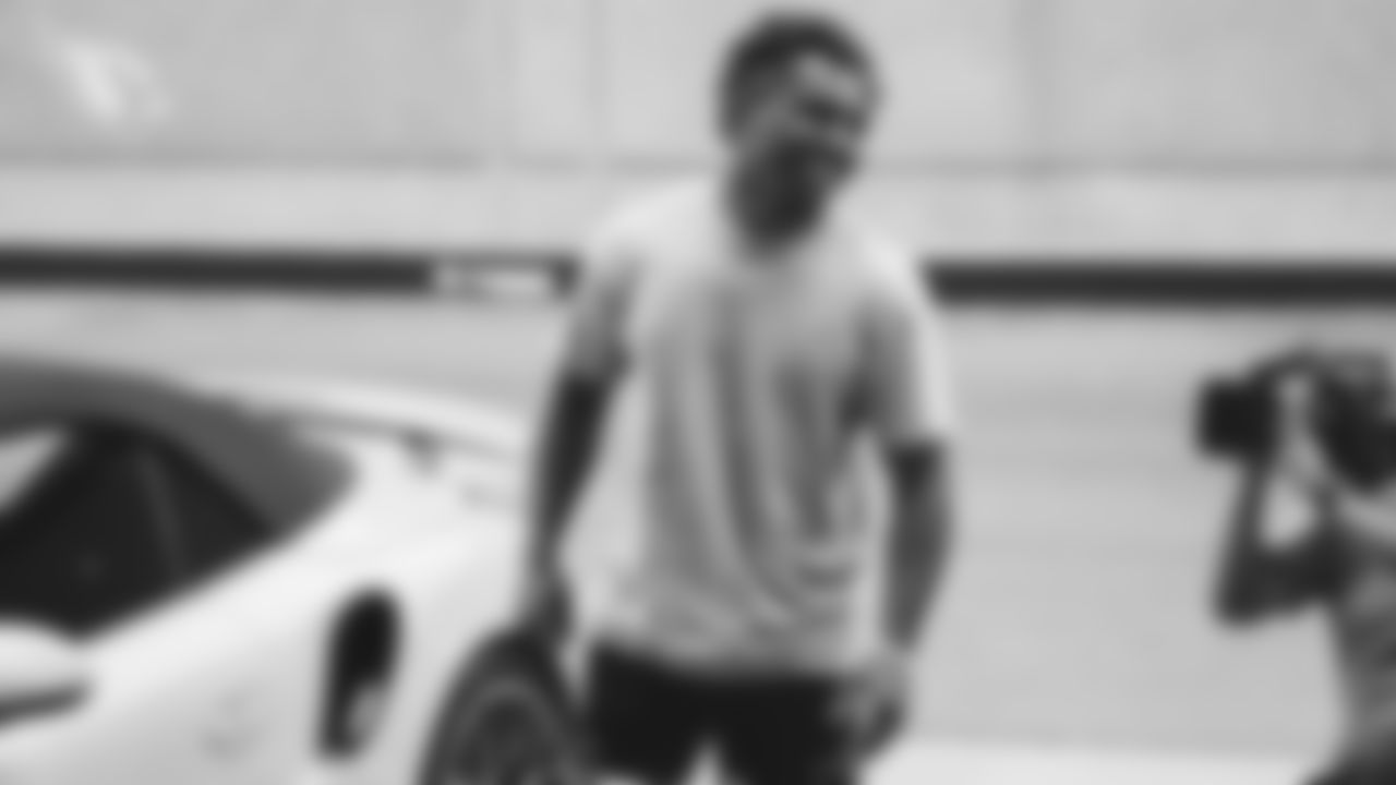 WR Christian Kirk laughs as RB D.J. Foster teases him about his car's paint colors