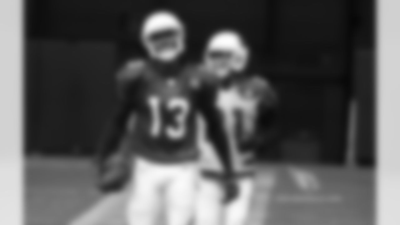 Day 16: WR Jaron Brown (left) with CB Patrick Peterson (right)