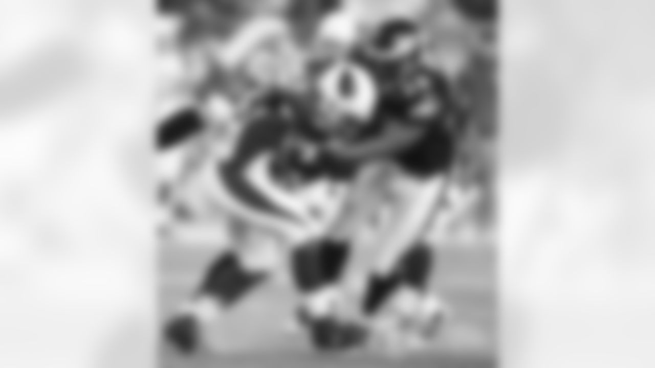 2008: RB J.J. Arrington gets tackled by Akeem Jackson