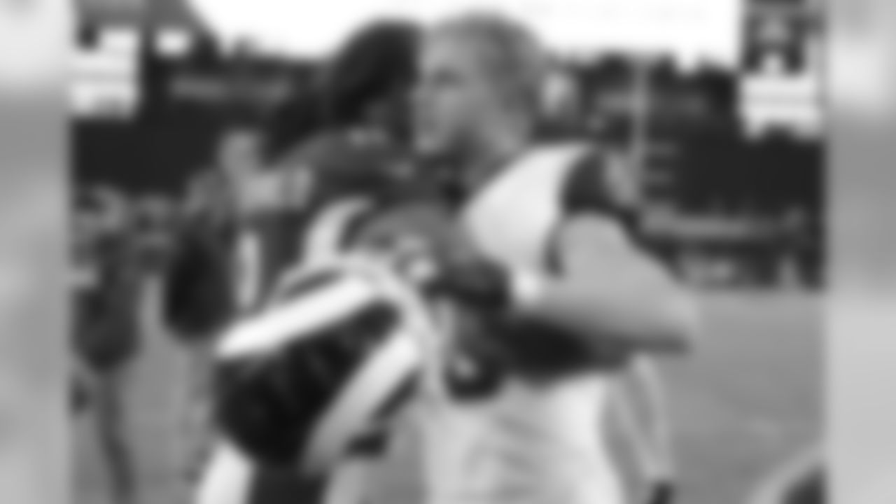 Rams wide receiver Cooper Kupp (right) greets Cardinals wide receiver Larry Fitzgerald after the game. The Rams won 34-7.