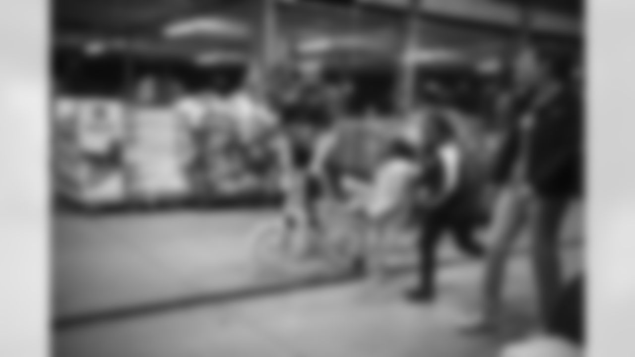 The Arizona Cardinals participate in Shop With A Jock with Desert Financial Credit Union at Walmart on Tuesday, December 13, 2022 in Tempe, AZ.