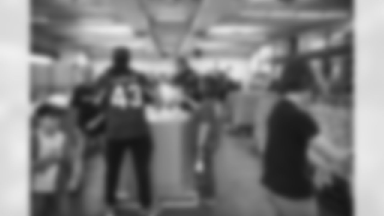 The Arizona Cardinals and Verizon help pack bags of food at United Food Bank on Tuesday, April 4, 2023 in Mesa, AZ.