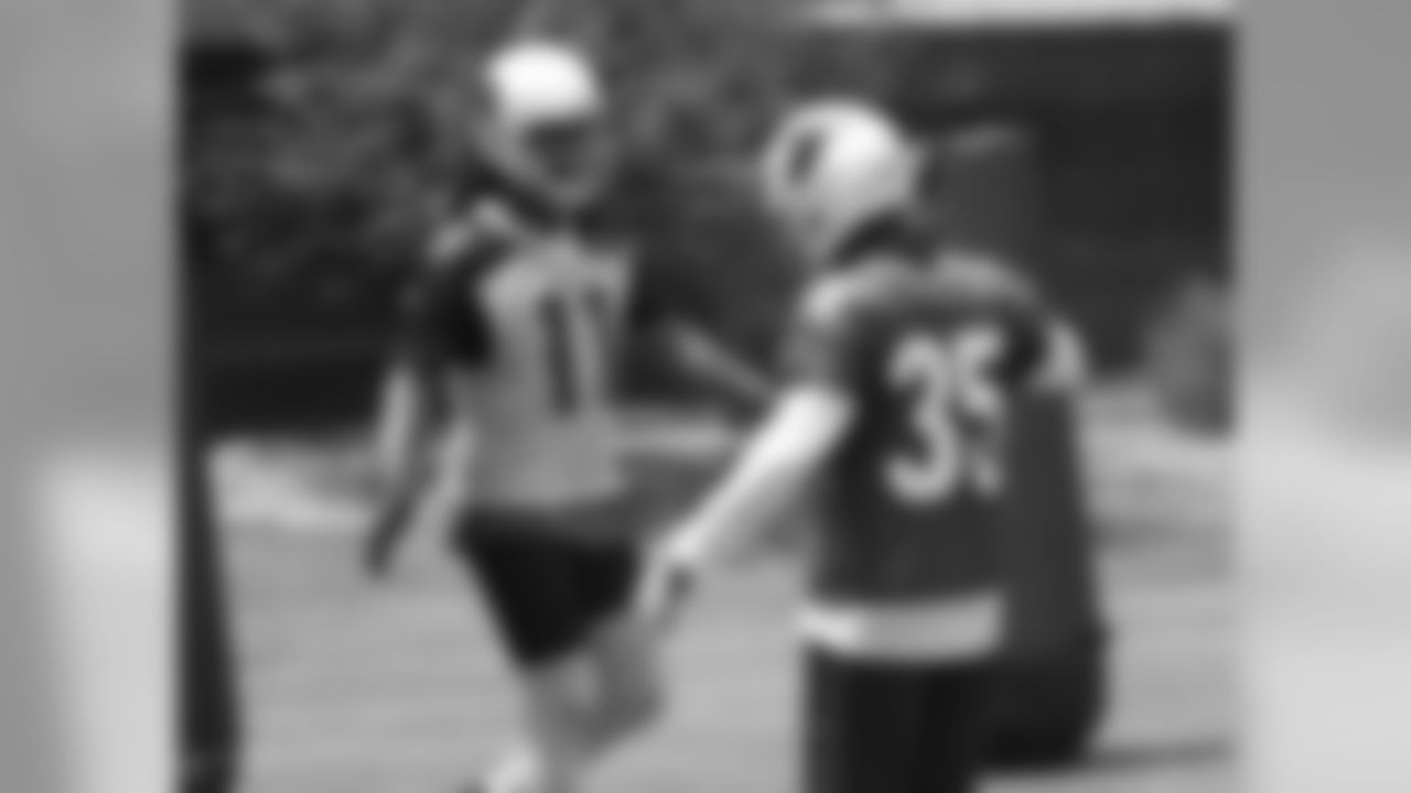 Fitz and Javier Arenas good-naturedly jaw after a play