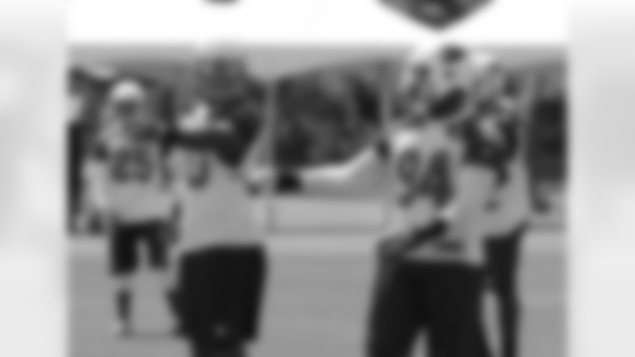 DT Darnell Dockett (90) and LB Sam Acho (94)
