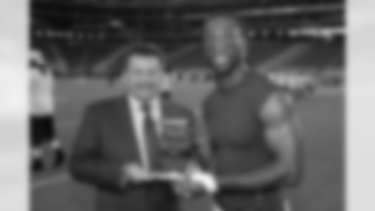 President Michael Bidwill presents Fitzgerald with Humanitarian Award
