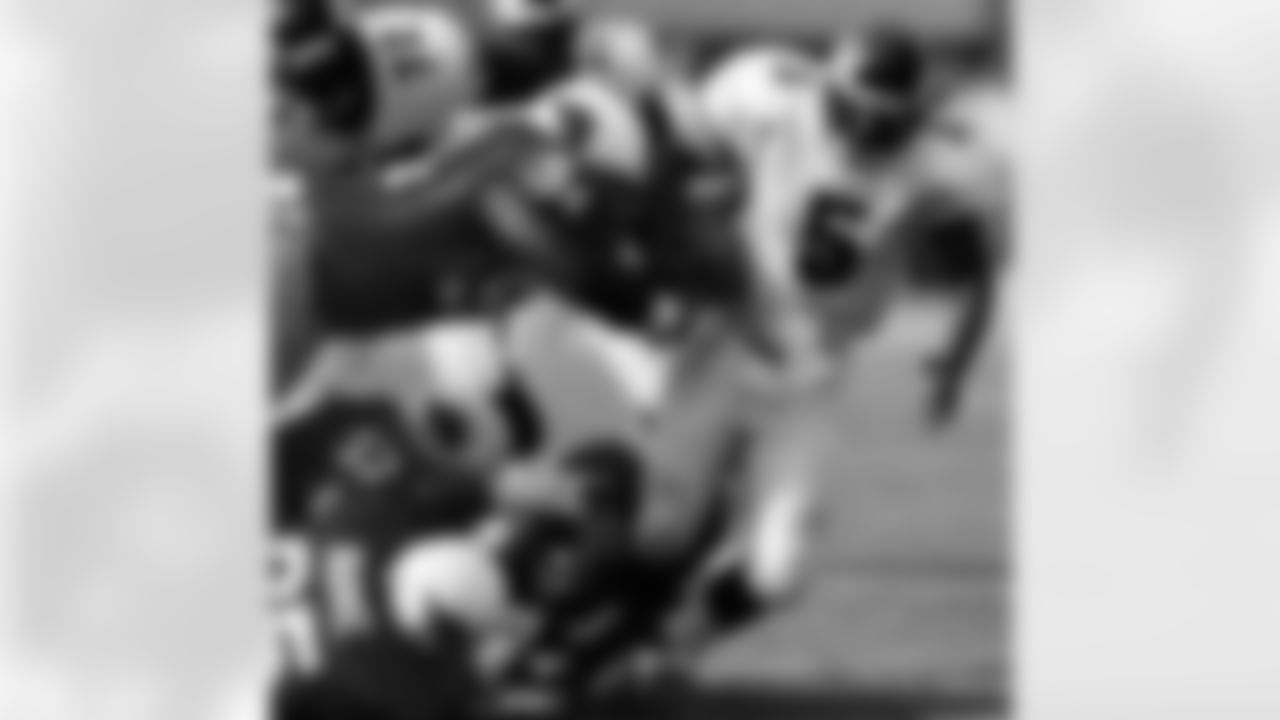 2001: Donovan McNabb is tackled by several Cardinals.