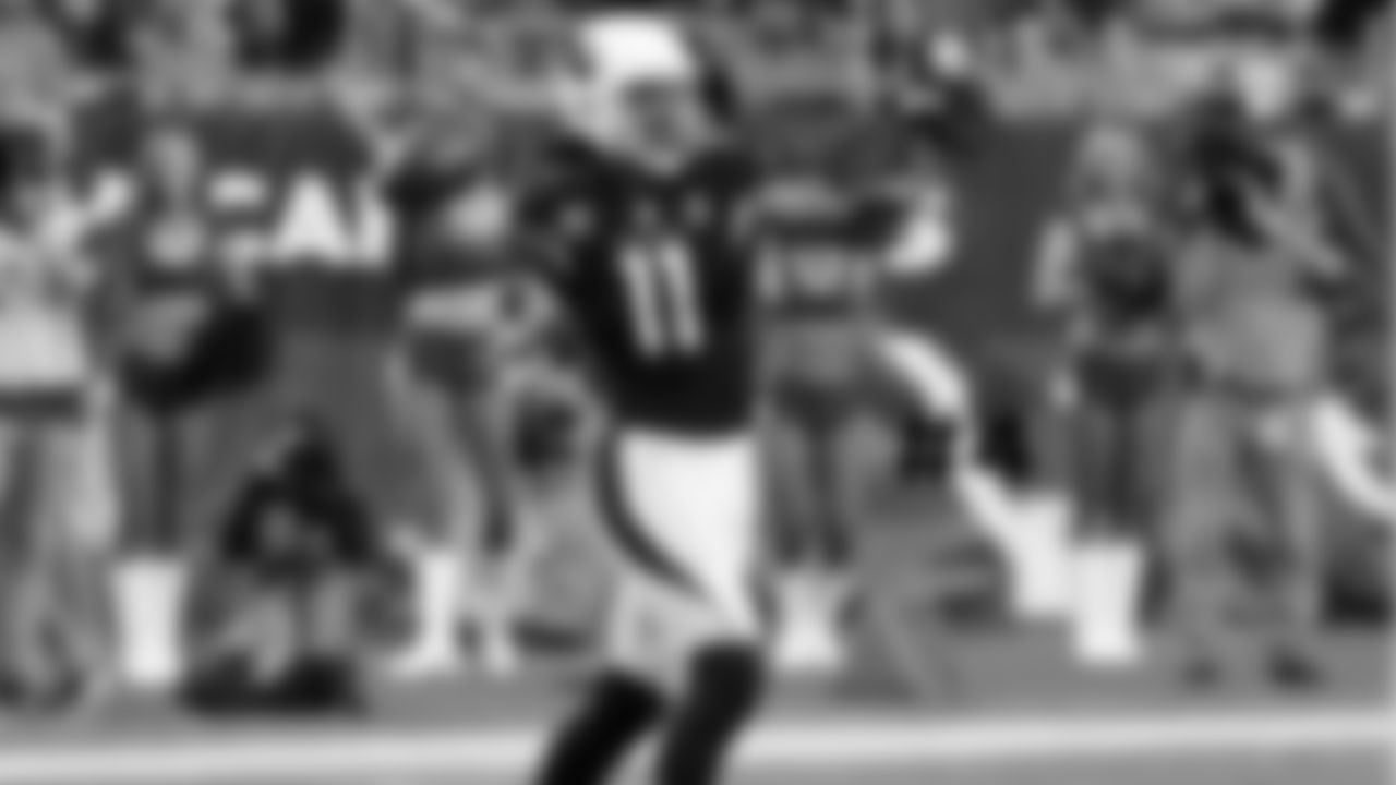 4. WR Larry Fitzgerald throws the football to the sideline to commemorate the most catches with one team in NFL history