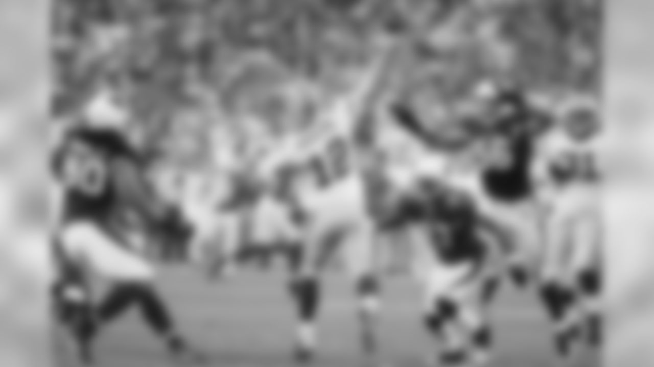 Packers QB Aaron Rodgers unloads a pass under duress.