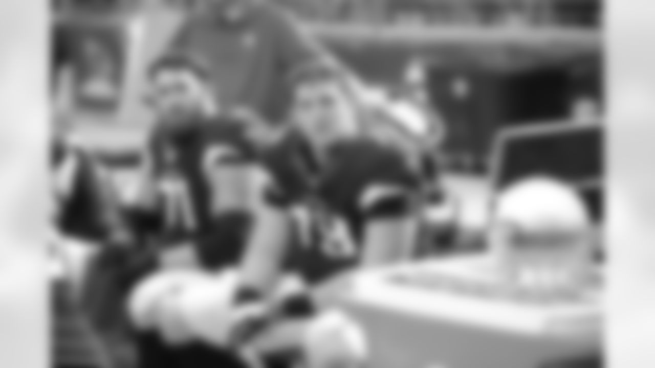 OL Bradley Sowell and Daryn Colledge sit on the bench during the Panthers game.