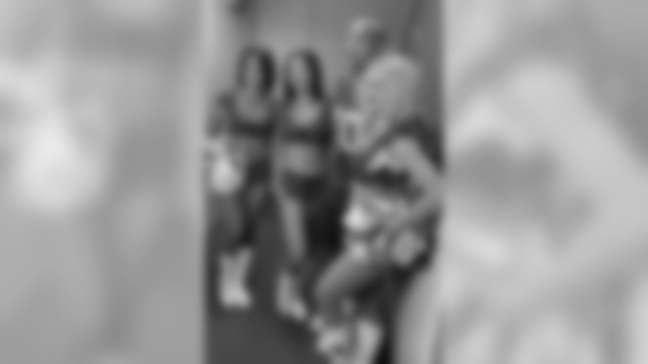Images of the Cardinals cheerleaders practicing and performing with celebrity fitness motivator Shaun T