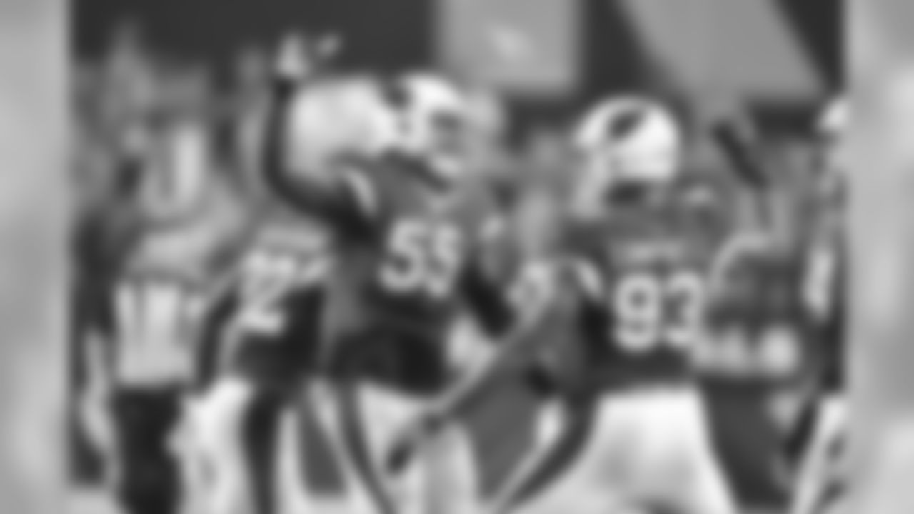 LB Chandler Jones (left) celebrates a play against the Patriots