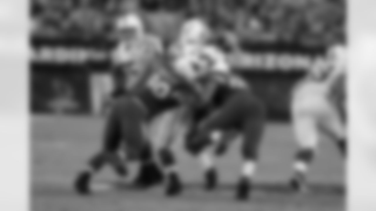DT Darnell Dockett (left) and DE Calais Campbell sandwich Colts QB Andrew Luck